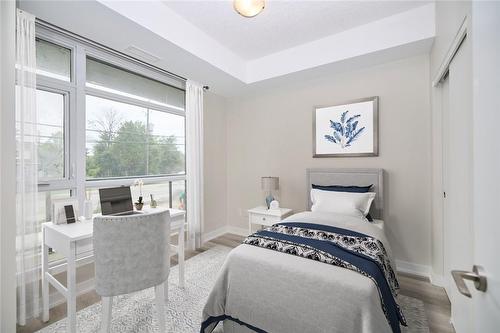 VIRTUALLY STAGED - 600 North Service Road|Unit #105, Hamilton, ON - Indoor Photo Showing Bedroom