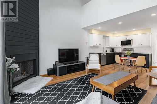 13 - 31 Laguna Parkway, Ramara, ON - Indoor Photo Showing Living Room With Fireplace
