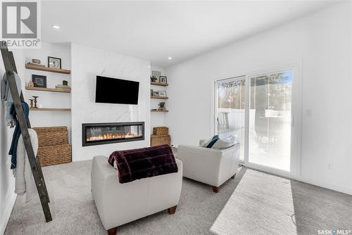 226 Hogg Way, Saskatoon, SK - Indoor Photo Showing Living Room With Fireplace