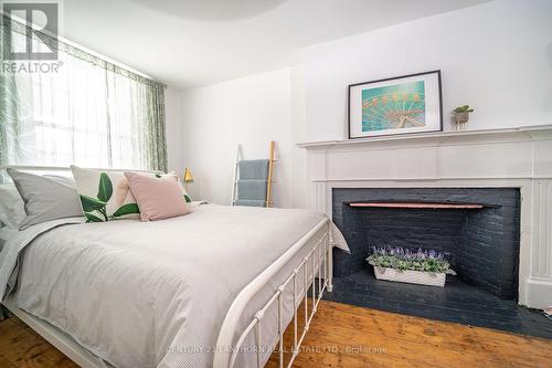 68 Mary Street, Prince Edward County, ON - Indoor Photo Showing Bedroom With Fireplace