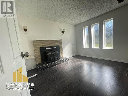 Imperial Street, Burnaby, BC - Indoor Photo Showing Living Room With Fireplace
