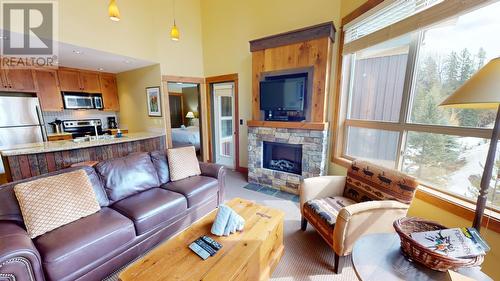 4559 Timberline Crescent Unit# 643C, Fernie, BC - Indoor Photo Showing Living Room With Fireplace