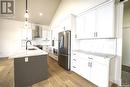323 Woolf Bay, Saskatoon, SK  - Indoor Photo Showing Kitchen With Stainless Steel Kitchen With Upgraded Kitchen 