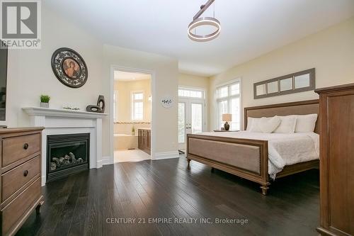 24 Ainley Trail, Halton Hills, ON - Indoor Photo Showing Bedroom With Fireplace
