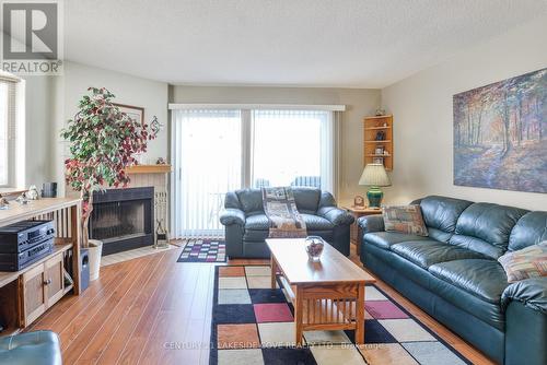 1 - 11 Laguna Parkway, Ramara (Brechin), ON - Indoor Photo Showing Living Room With Fireplace