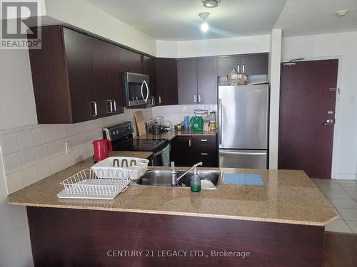 #306 -7405 Goreway Dr, Mississauga, ON - Indoor Photo Showing Kitchen With Double Sink