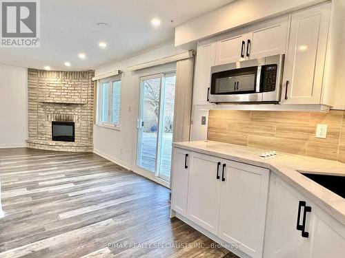 6701 Snow Goose Lane, Mississauga, ON - Indoor Photo Showing Kitchen With Fireplace