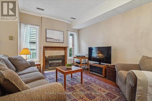 #11 -110 Mary St W, Whitby, ON - Indoor Photo Showing Living Room With Fireplace