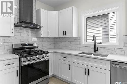 734 Delainey Court, Saskatoon, SK - Indoor Photo Showing Kitchen With Double Sink With Upgraded Kitchen