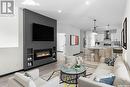 734 Delainey Court, Saskatoon, SK  - Indoor Photo Showing Living Room With Fireplace 