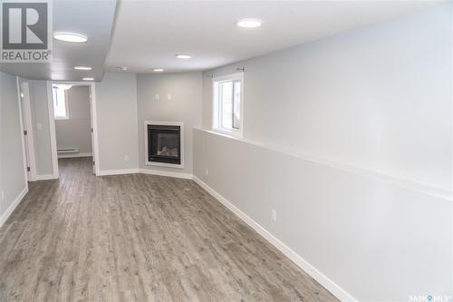 407 Bolstad Link, Saskatoon, SK - Indoor Photo Showing Other Room With Fireplace