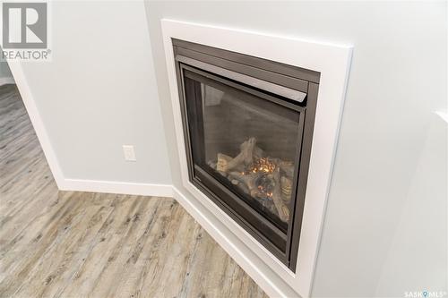407 Bolstad Link, Saskatoon, SK - Indoor Photo Showing Other Room With Fireplace