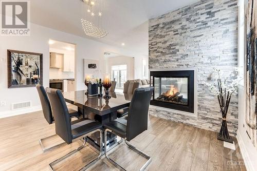 576 Cope Drive, Ottawa, ON - Indoor Photo Showing Dining Room With Fireplace