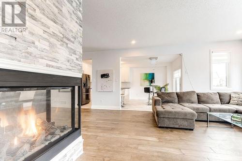 576 Cope Drive, Ottawa, ON - Indoor Photo Showing Living Room With Fireplace