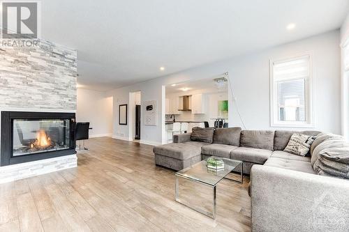 576 Cope Drive, Ottawa, ON - Indoor Photo Showing Living Room With Fireplace