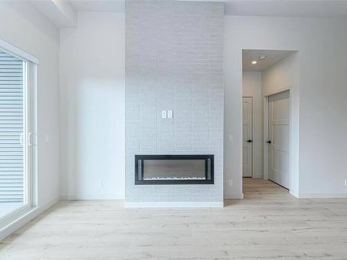 612-947 Whirlaway Cres, Langford, BC - Indoor Photo Showing Living Room With Fireplace