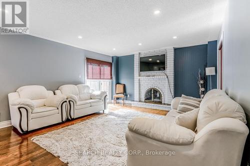 8 Ridelle Crt, Brampton, ON - Indoor Photo Showing Living Room With Fireplace
