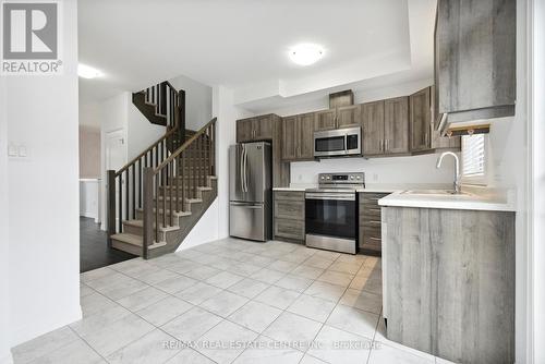#296 -30 Times Square Blvd, Hamilton, ON - Indoor Photo Showing Kitchen With Double Sink