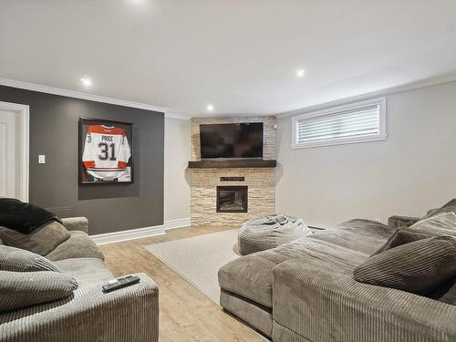 Family room - 48 Rue De Lindoso, Blainville, QC - Indoor With Fireplace