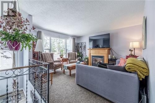 1 Summer Street, Deep River, ON - Indoor Photo Showing Living Room With Fireplace