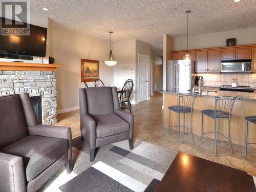 400 Bighorn Boulevard Unit# 425 C, Radium Hot Springs, BC - Indoor Photo Showing Other Room With Fireplace