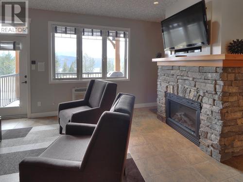 400 Bighorn Boulevard Unit# 425 C, Radium Hot Springs, BC - Indoor Photo Showing Living Room With Fireplace