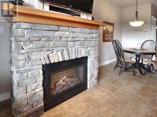 400 Bighorn Boulevard Unit# 425 C, Radium Hot Springs, BC - Indoor Photo Showing Living Room With Fireplace