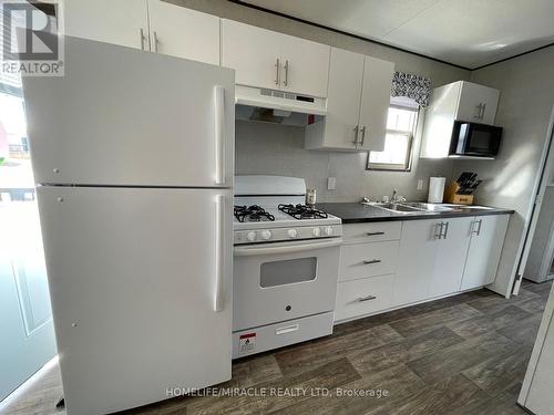 #34 -1235 Villiers Line, Otonabee-South Monaghan, ON - Indoor Photo Showing Kitchen With Double Sink