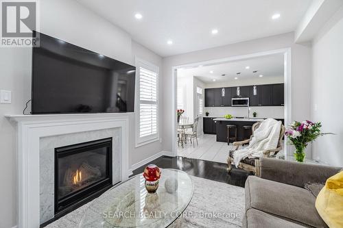 8 Nightland Crt, Brampton, ON - Indoor Photo Showing Living Room With Fireplace