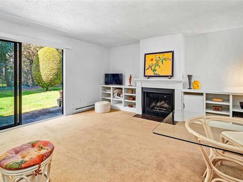 B-3056 Washington Ave, Victoria, BC - Indoor Photo Showing Living Room With Fireplace