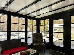 Custom windows that lower right to the bottom during warmer weather and include full height screening. - 