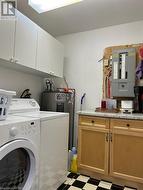 Laundry room with extra storage and folding counter. - 