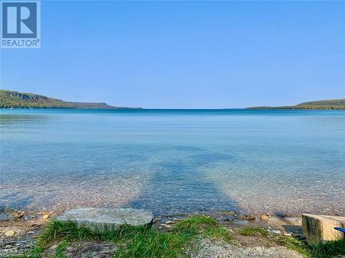 There also is 500ft wide public beach about a 5min walk from the property with General Store & Ice Cream. - 41 Water Street, South Bruce Peninsula, ON - Outdoor With Body Of Water With View