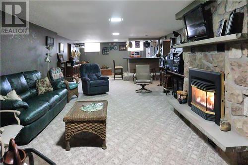 881 Olivier Street, Verner, ON - Indoor Photo Showing Living Room With Fireplace