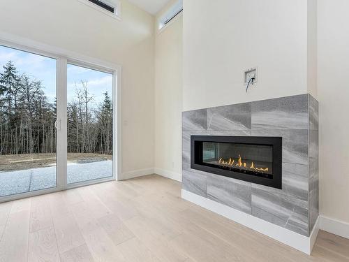 4656 Galdwell Rd, Cowichan Bay, BC - Indoor Photo Showing Living Room With Fireplace