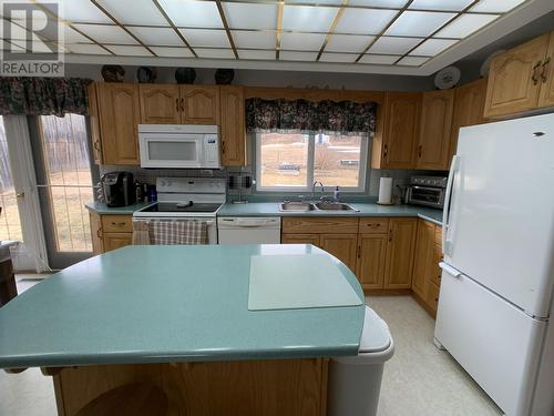 7754 Alaska Highway, Fort Nelson, BC - Indoor Photo Showing Kitchen With Double Sink