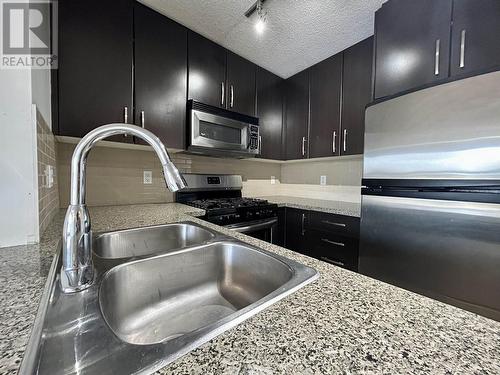 605 5068 Kwantlen Street, Richmond, BC - Indoor Photo Showing Kitchen With Stainless Steel Kitchen With Double Sink With Upgraded Kitchen