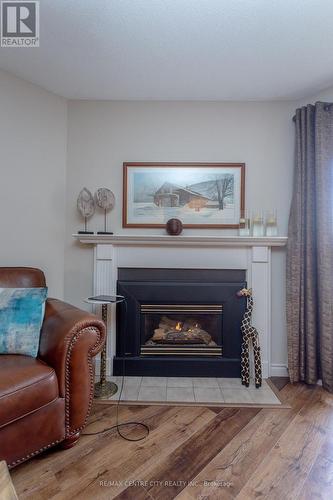 #201 -440 Wellington St S, St. Thomas, ON - Indoor Photo Showing Living Room With Fireplace