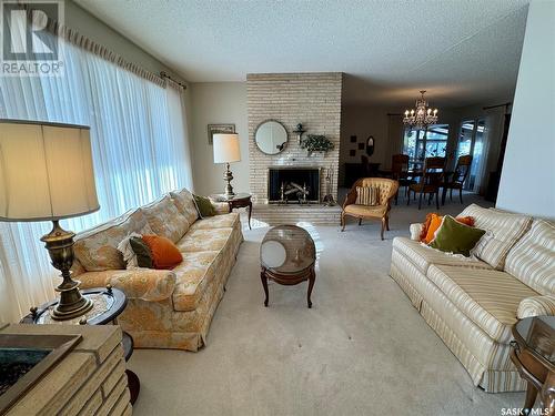 83 Logan Crescent W, Yorkton, SK - Indoor Photo Showing Living Room With Fireplace