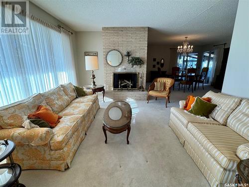 83 Logan Crescent W, Yorkton, SK - Indoor Photo Showing Living Room With Fireplace