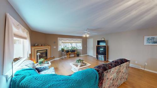 36 - 2025 Kokanee Drive N, Cranbrook, BC - Indoor Photo Showing Living Room With Fireplace
