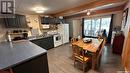 12 Oskunamoo Drive, Greenwater Provincial Park, SK  - Indoor Photo Showing Kitchen With Double Sink 