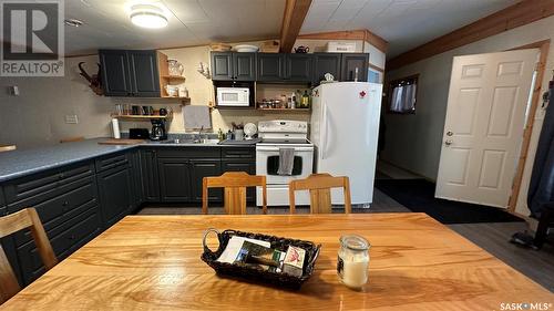 12 Oskunamoo Drive, Greenwater Provincial Park, SK - Indoor Photo Showing Kitchen With Double Sink