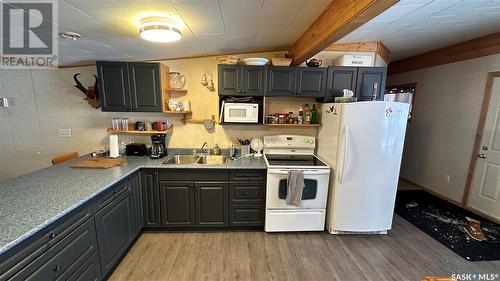 12 Oskunamoo Drive, Greenwater Provincial Park, SK - Indoor Photo Showing Kitchen With Double Sink