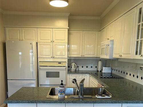 217-4490 Chatterton Way, Saanich, BC - Indoor Photo Showing Kitchen With Double Sink