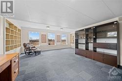 Lower level rec room with fews of the paddocks - 