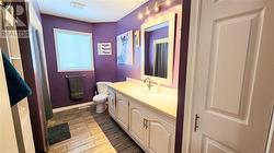 The large main bathroom features plenty of style, storage and function. - 