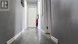The hallway on the second level leads to the bedrooms and the main bathroom. - 