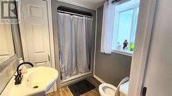 The second bathroom on the main floor is adjacent to the family room. - 