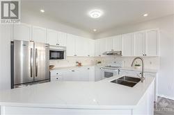 upgraded functional kitchen w/ quartz countertops & New appliances - 